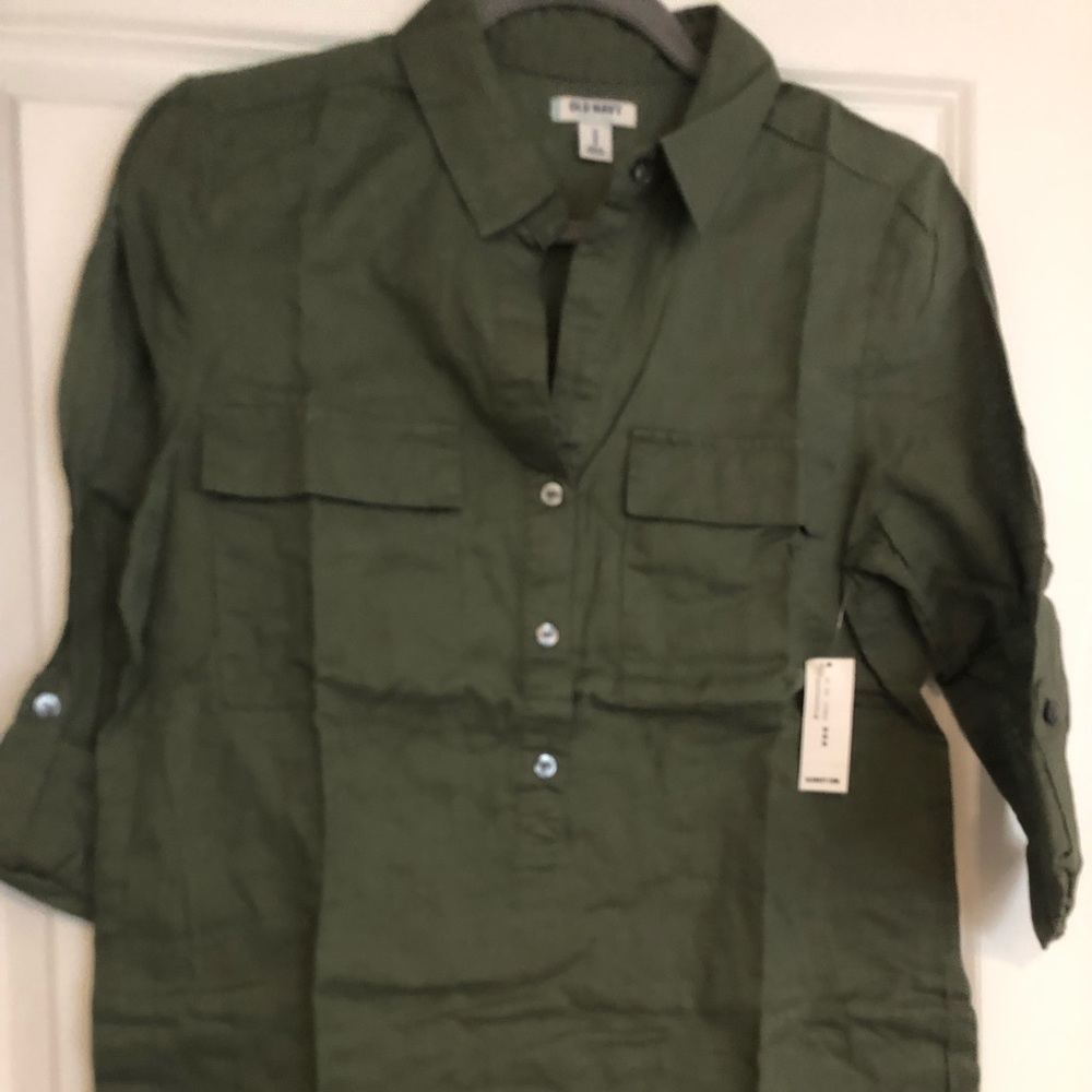 Woman’s olive colored top